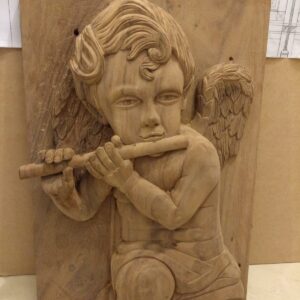 Niño angel con flauta